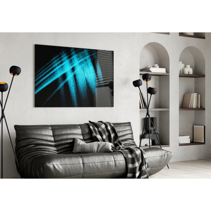 Black leather couch with plaid throw and stunning blue abstract glass wall art