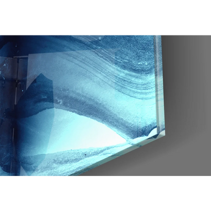 Stunning blue abstract glass wall art with textured marble waves