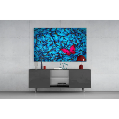 Vibrant blue butterfly glass wall art with pink accent pop