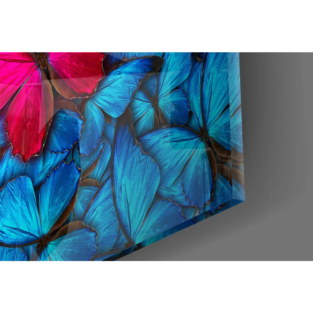 Vibrant blue butterfly glass wall art with pink accent pop
