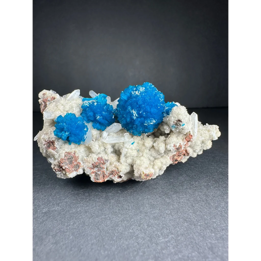 Vibrant blue cavansite crystal cluster from India on mineral matrix