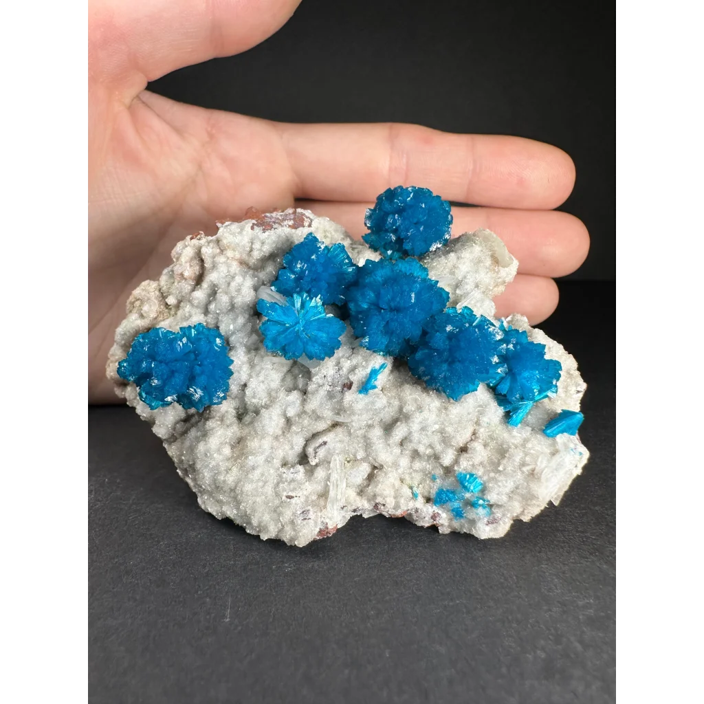 Vibrant blue copper sulfate crystals on white rock matrix from India