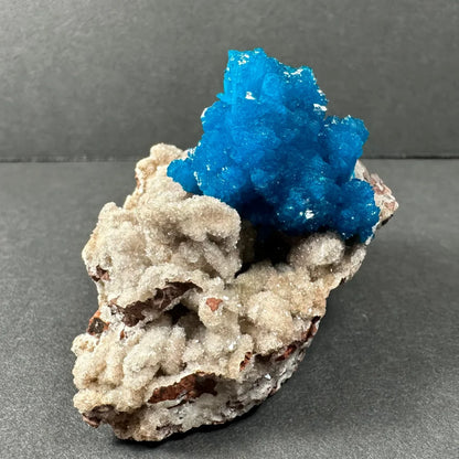 Stunning blue Cavansite crystal cluster from India on gray rock