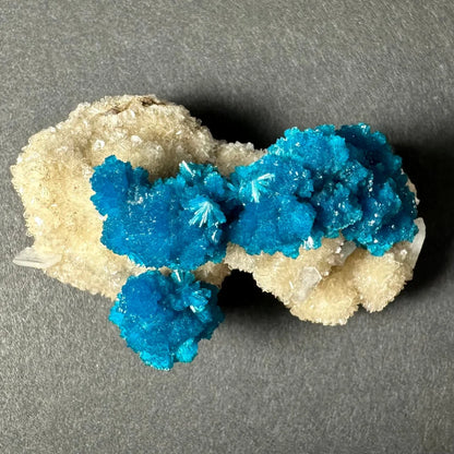 Stunning blue cavansite crystal cluster from India on pale matrix
