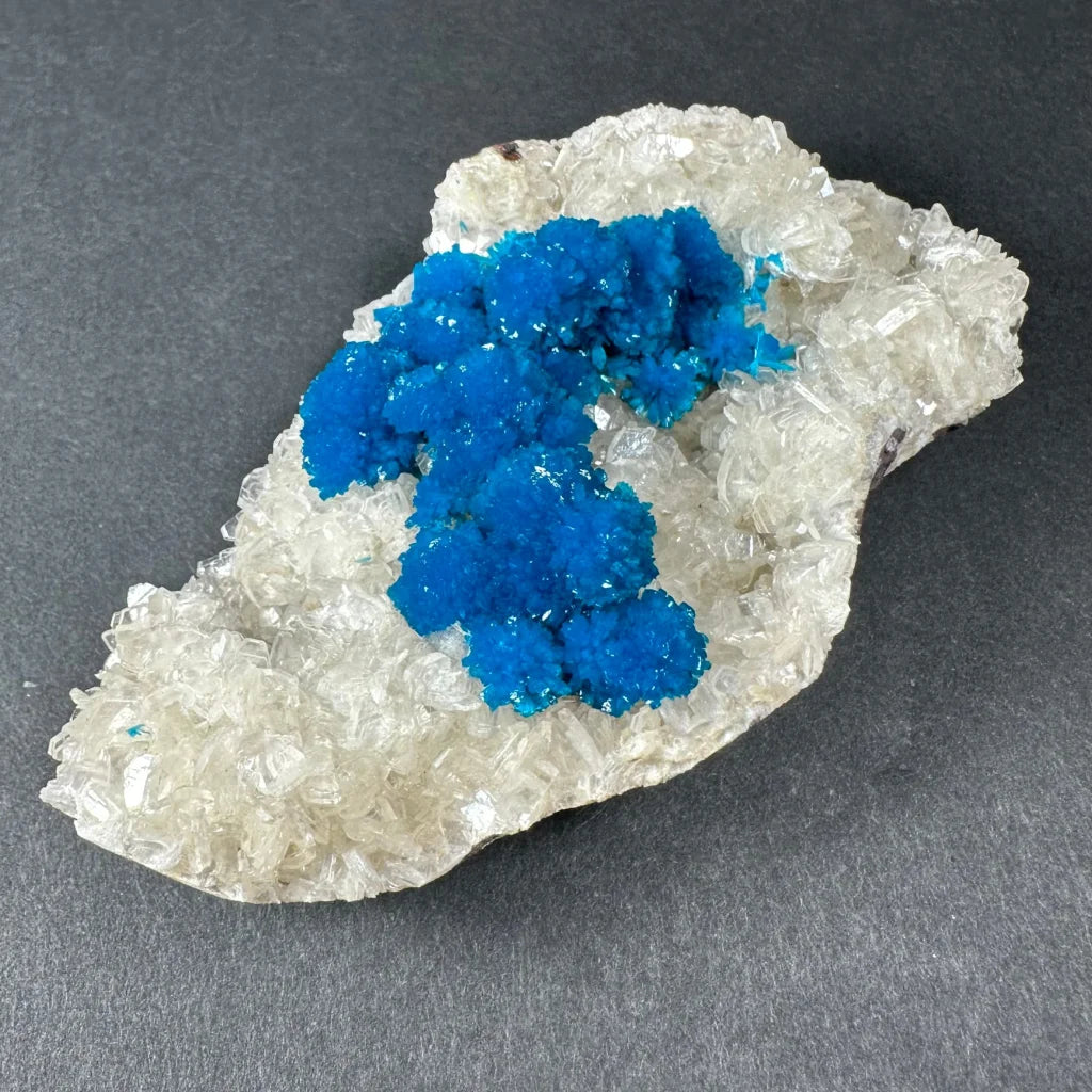 Vibrant blue cavansite crystals on quartz from Pune India