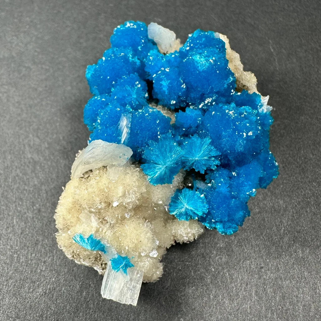 Vibrant blue copper sulfate crystals on white stilbite quartz matrix