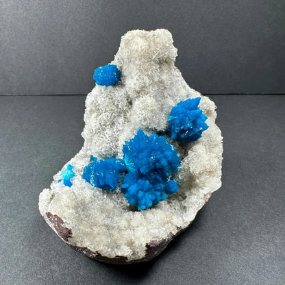 Vibrant blue cavansite crystals on white stilbite matrix Maharashtra