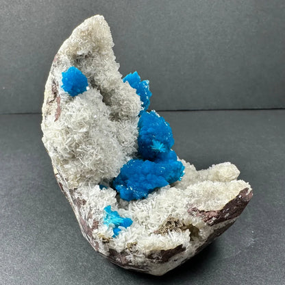 Vibrant blue cavansite on white stilbite matrix from Maharashtra