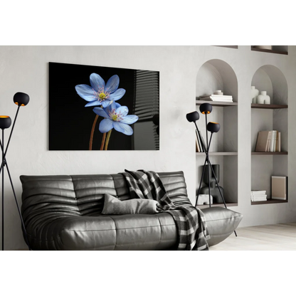 Black leather sofa with plaid throw and stunning blue flower wall art