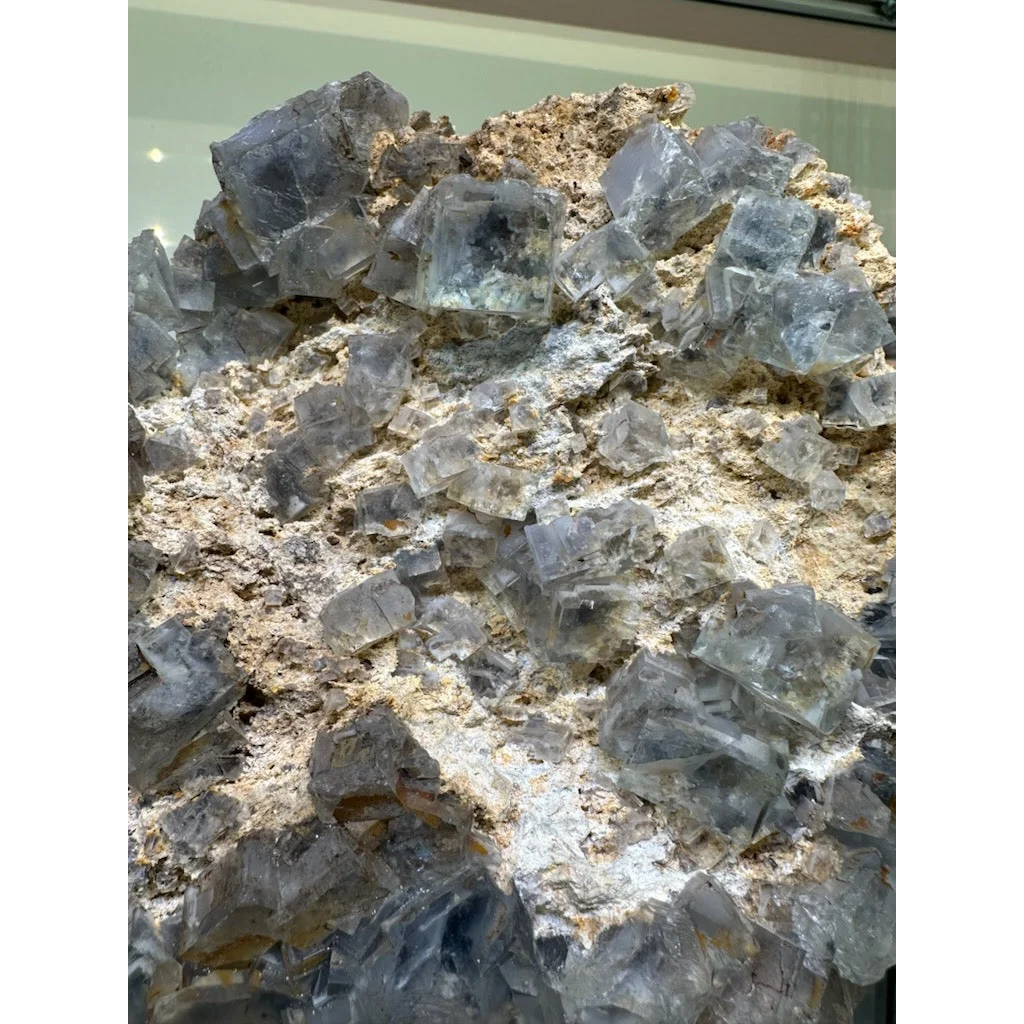 Stunning blue fluorite crystal cluster from China on earthy matrix