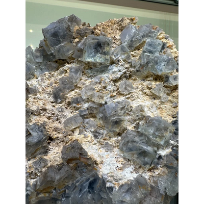 Stunning blue fluorite crystal cluster from China on earthy matrix