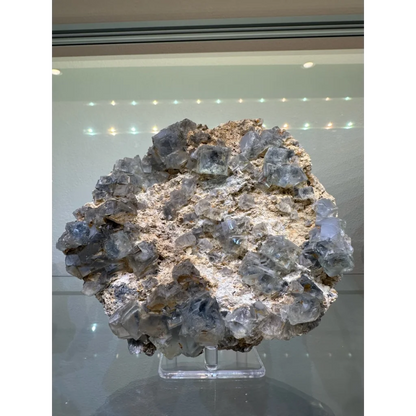 Stunning blue fluorite crystal cluster from China on beige matrix