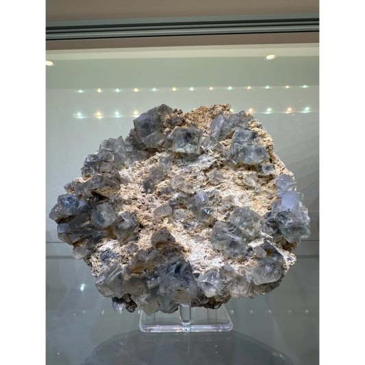 Stunning blue fluorite crystal cluster from China on beige matrix
