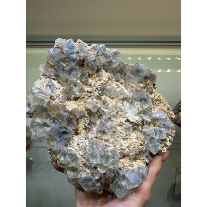 Stunning blue fluorite crystal cluster from China on beige matrix