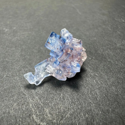 Stunning blue fluorite cube from Minerva Mine with translucent purple facets