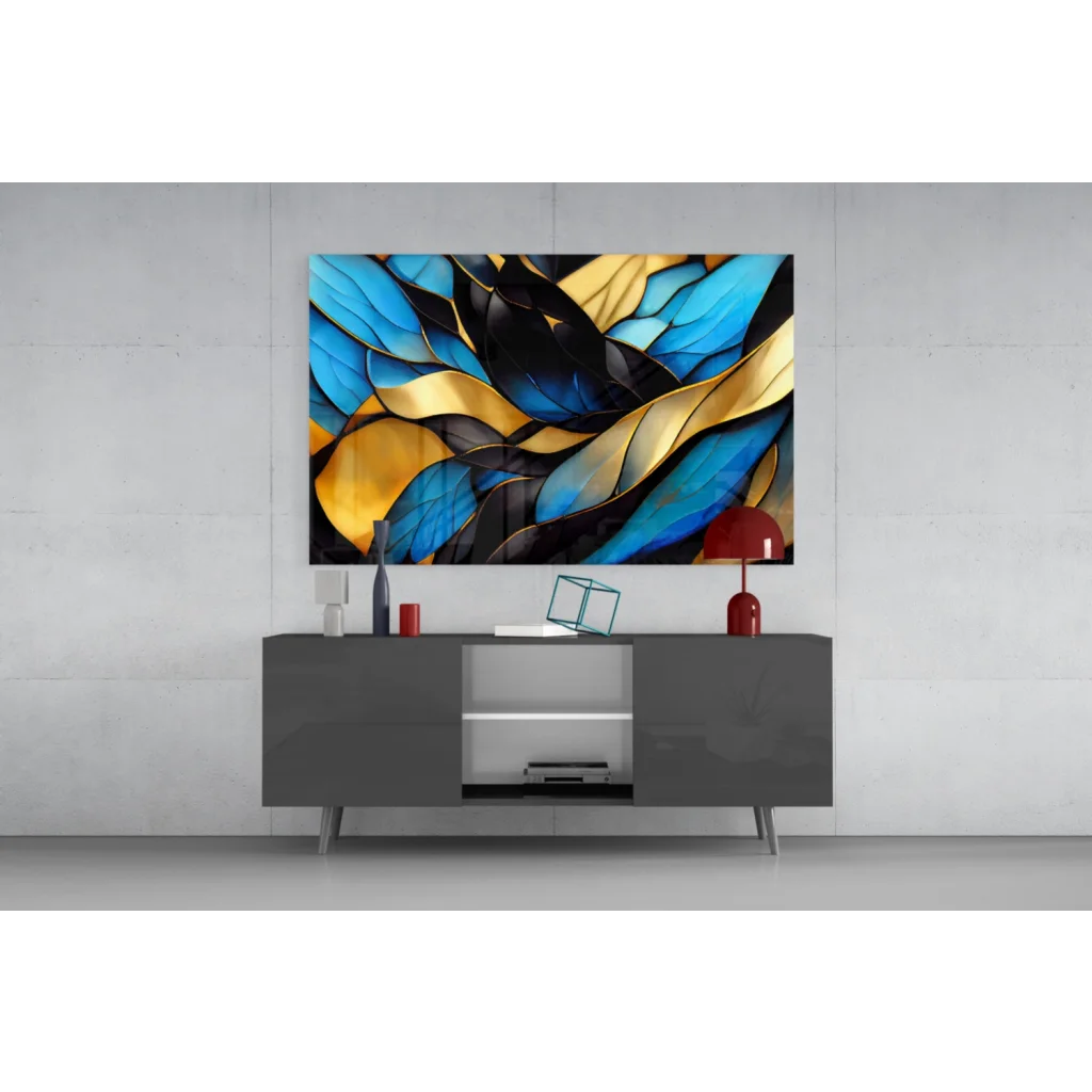 Modern gray TV stand with glossy finish and sleek silver legs below stunning blue gold abstract wall art with bold black accents