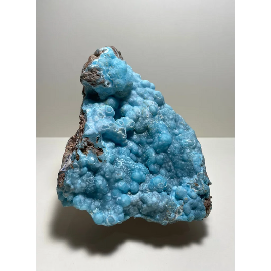 Vibrant blue hemimorphite botryoidal specimen on brown matrix