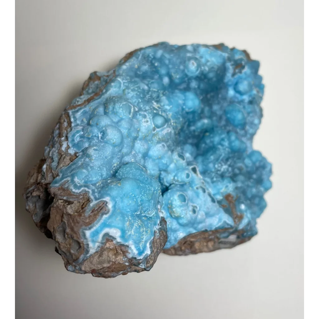 Vibrant blue hemimorphite botryoidal specimen on brown matrix