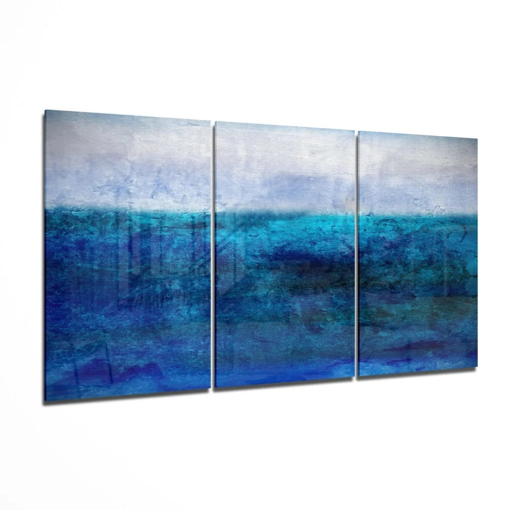 Stunning blue ocean triptych glass wall art in shades of blue and white