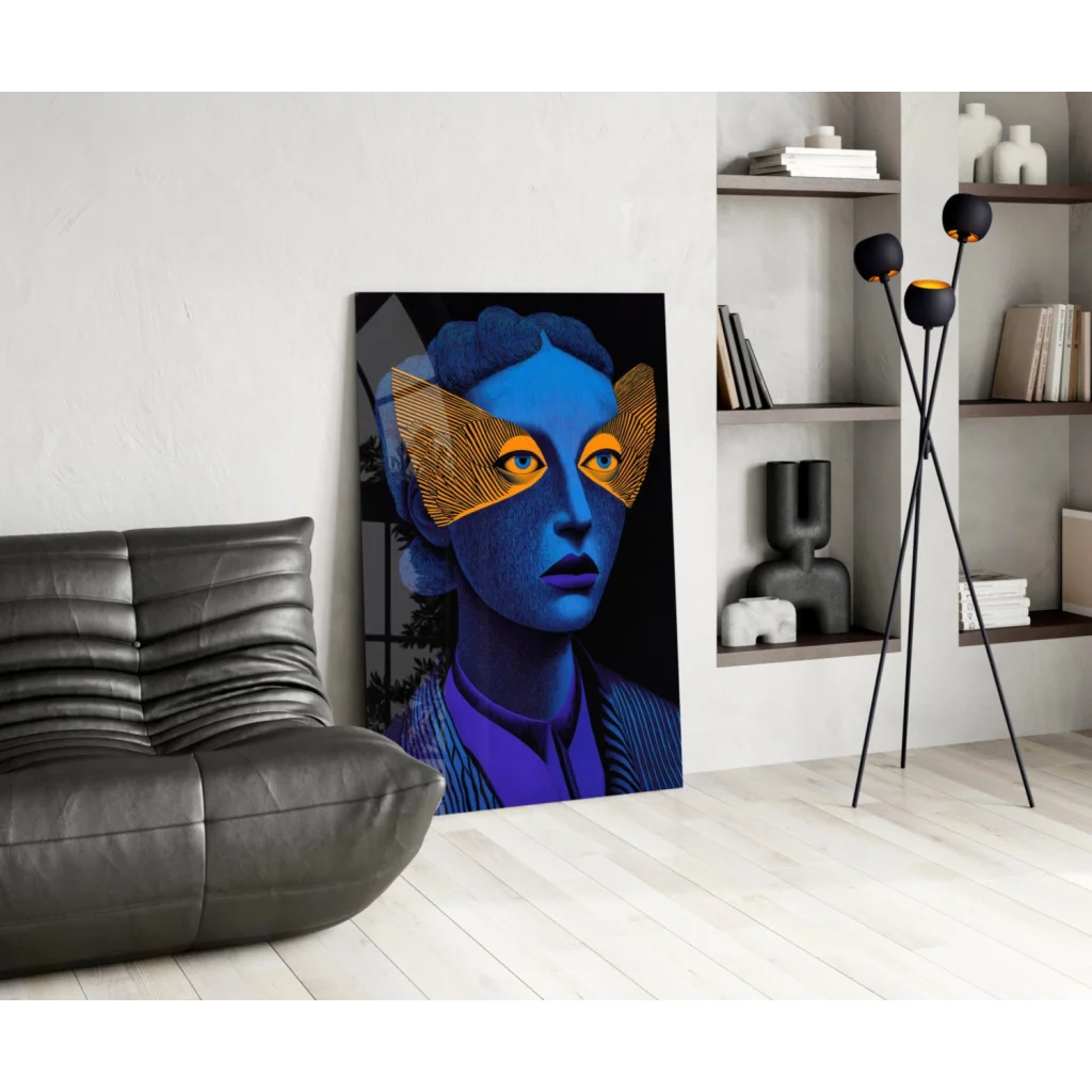 Vibrant blue portrait glass wall art with golden wing eyes and bold purple lips