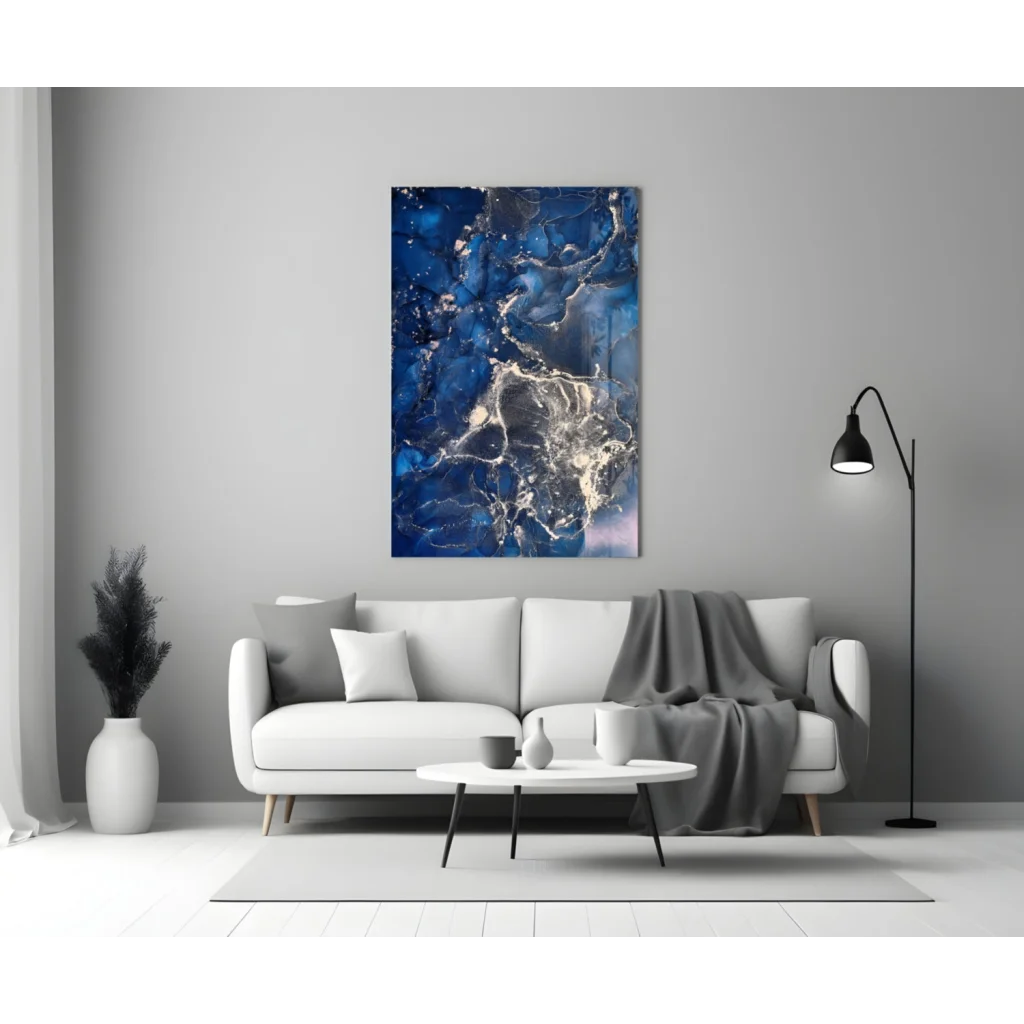 Blue and white swirling glass wall art above sofa