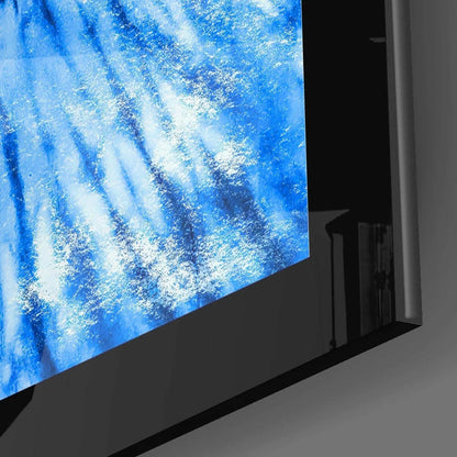 Sleek curved glass wall art with blue waterfall scene in black frame