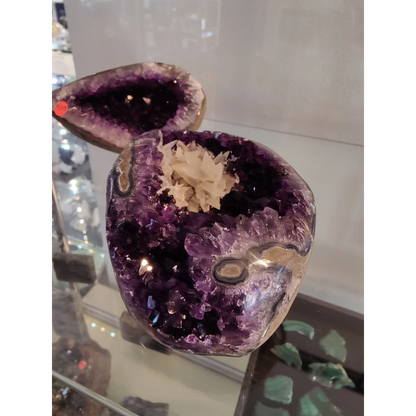 Stunning Brazilian amethyst geode with dogtooth calcite cluster inclusion