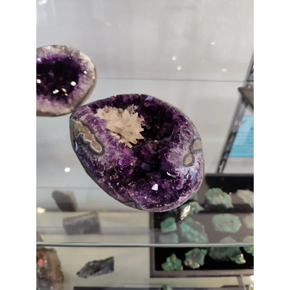 Stunning Brazilian amethyst geode with dogtooth calcite cluster inclusion