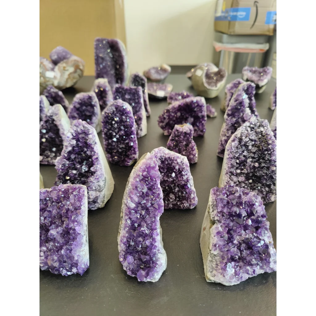 Stunning Brazilian amethyst cut base geode with purple crystals and quartz