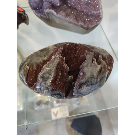 Stunning Brazilian amethyst geode with red crystal interior