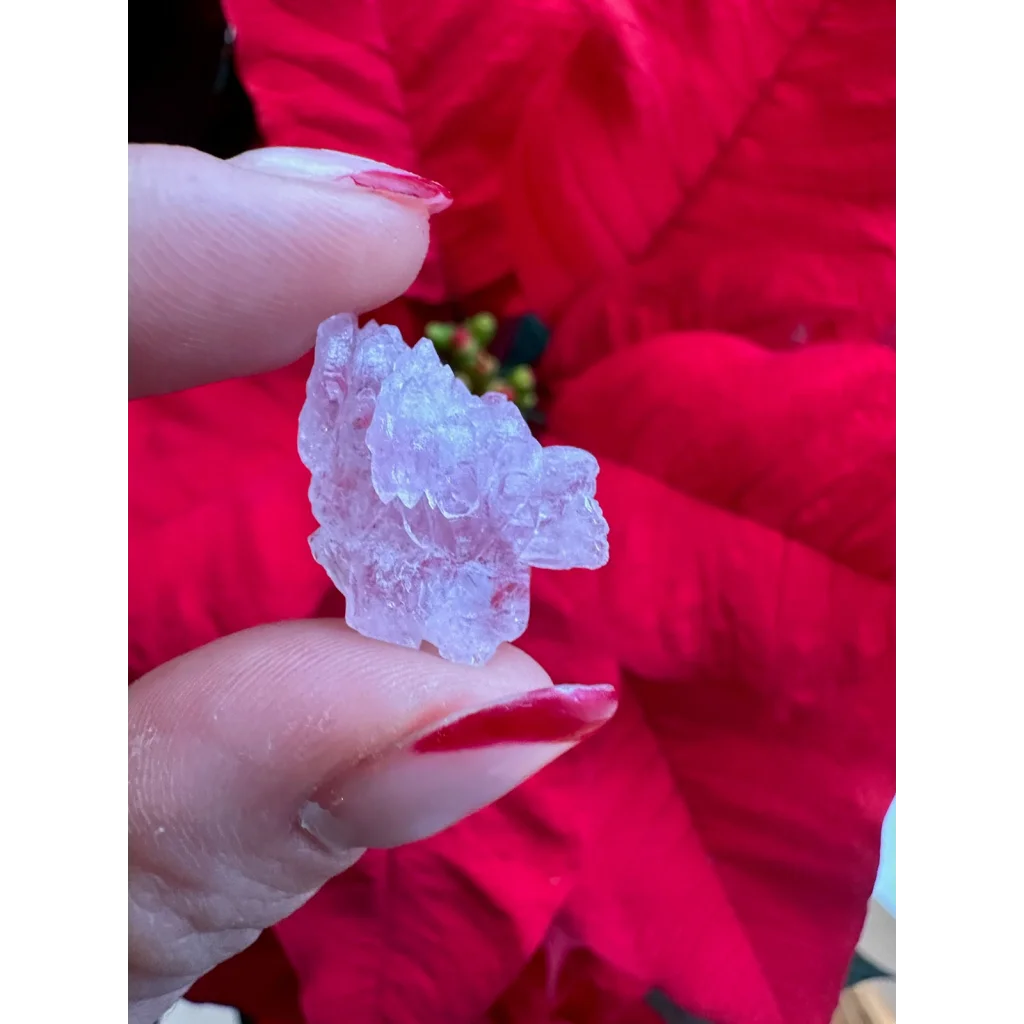 Stunning rose quartz crystal cluster with leaf-like icy facets