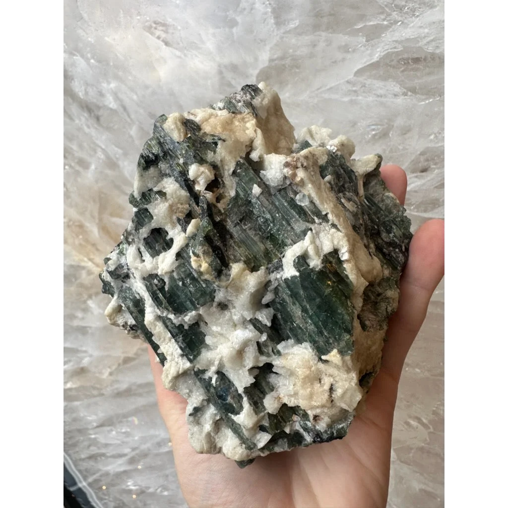 Stunning Brazilian tourmaline crystals on albite matrix in hand