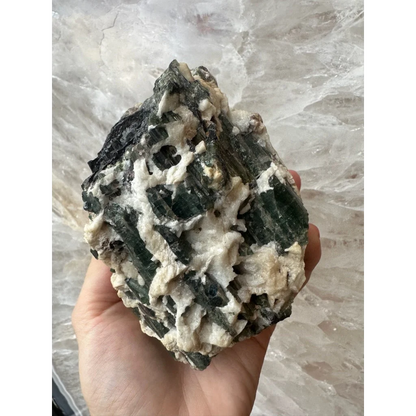 Stunning Brazilian Tourmaline on Albite crystal powerhouse held in hand
