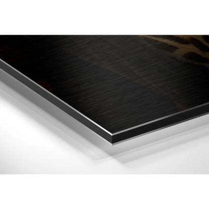 Black wooden cutting board with silver edge on brushed aluminium dibond print