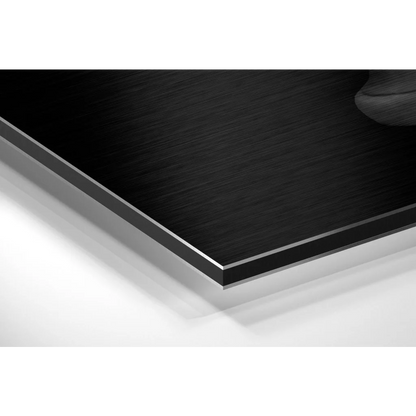 Black wooden coffee table with silver edge on brushed aluminium dibond art