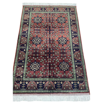 Stunning burgundy Bukharayi rug with intricate Afghani patterns