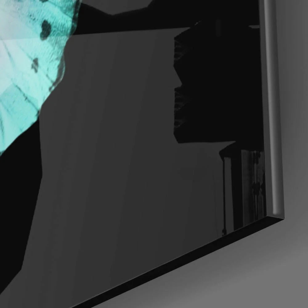 Sleek dark-framed glass wall art mirror with turquoise butterfly wings and urban teal reflection