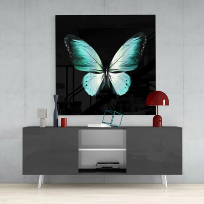Stunning teal butterfly glass wall art with turquoise wings on black background