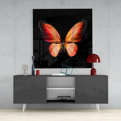 Vibrant orange red butterfly glass wall art with glossy wings