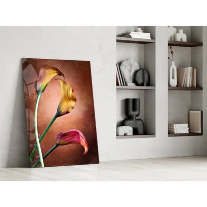 Vibrant yellow and pink calla lily wall art on white wall