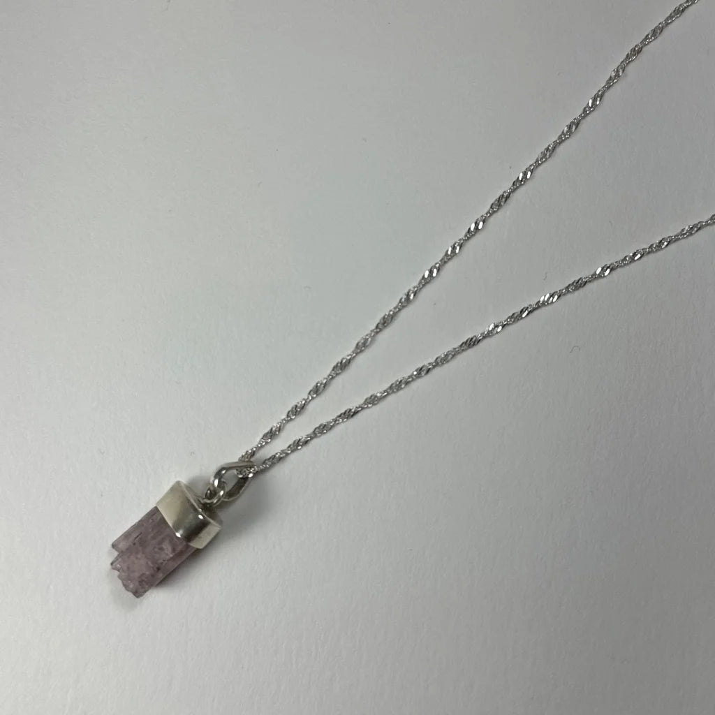 Delicate silver necklace with raw faceted purple amethyst pendant