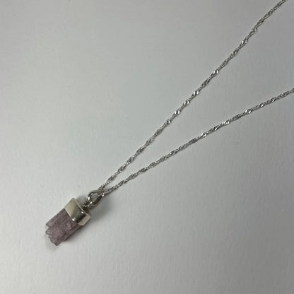 Delicate silver necklace with raw faceted purple amethyst pendant