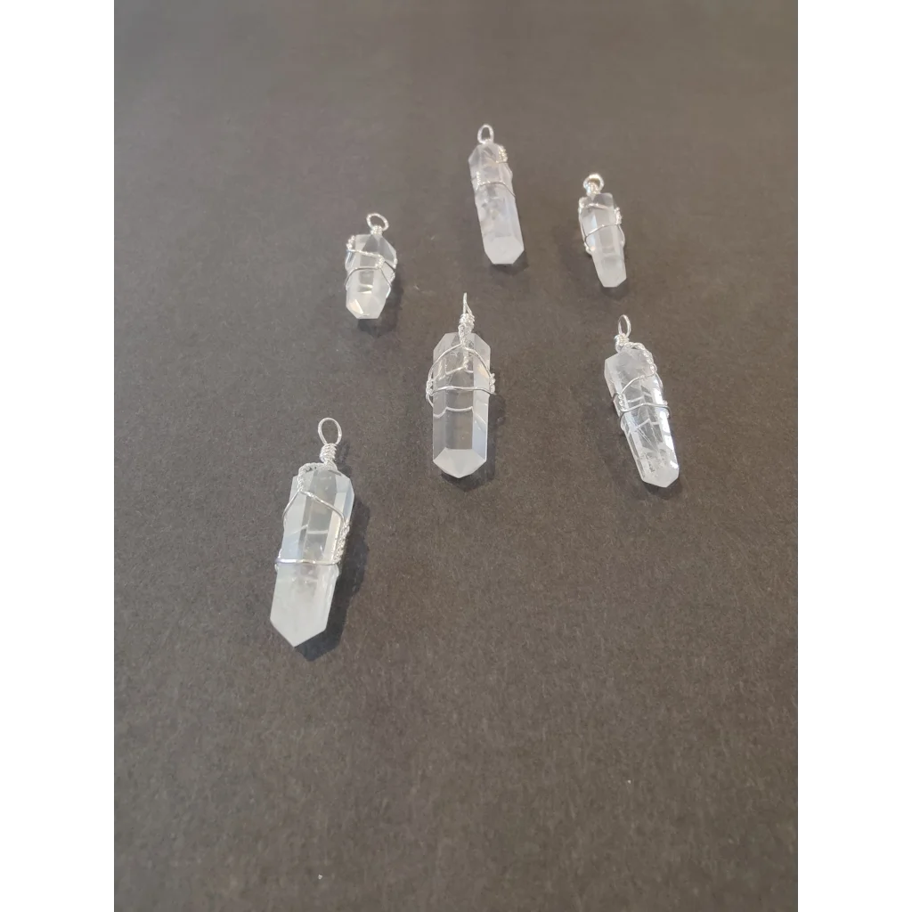 Stunning clear quartz crystal pendants wrapped in silver wire