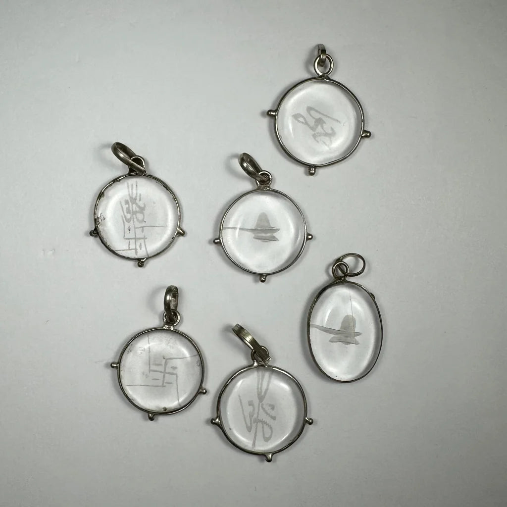 Stunning silver crystal pendants with engraved designs