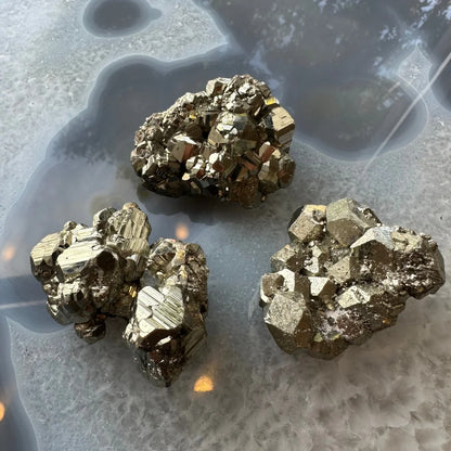 Stunning cubic pyrite cluster with golden metallic crystals