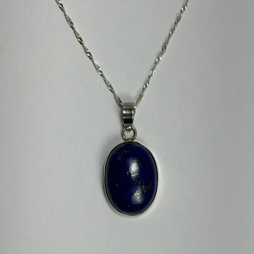 Stunning deep blue lapis lazuli pendant in sterling silver on twisted chain