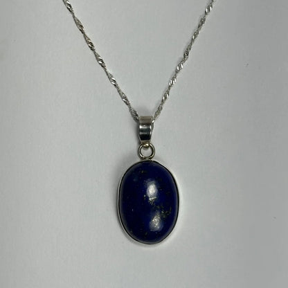 Stunning deep blue lapis lazuli pendant in sterling silver on twisted chain