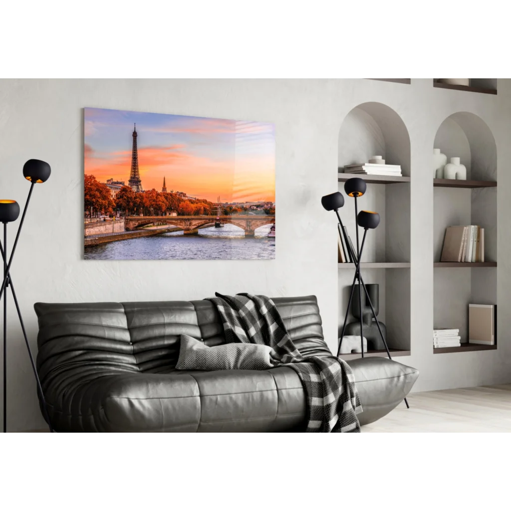 Stunning Eiffel Tower sunset wall art canvas with black leather sofa and plaid throw