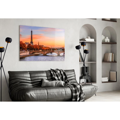 Stunning Eiffel Tower sunset wall art canvas with black leather sofa and plaid throw