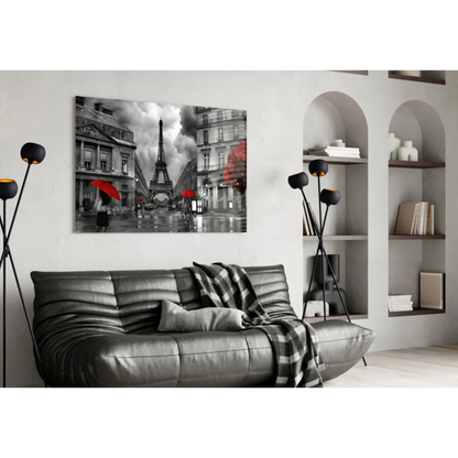 Black leather couch with red plaid throw and Eiffel Tower wall art